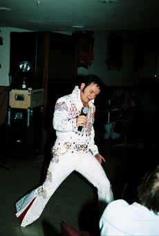 Mike as Elvis in white jumpsuit